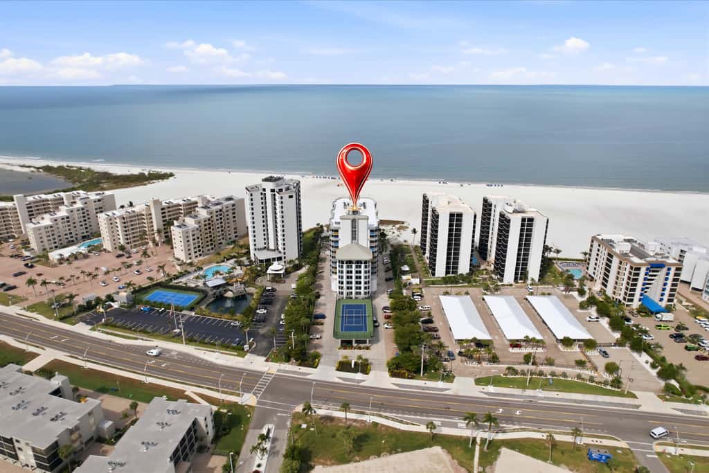 Beachfront Bliss, Cozy Condo with Patio, Pool & Stunning Views!