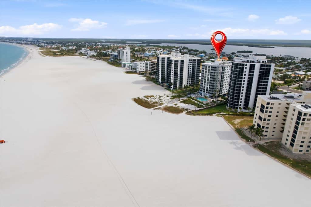 Beachfront Bliss, Cozy Condo with Patio, Pool & Stunning Views!