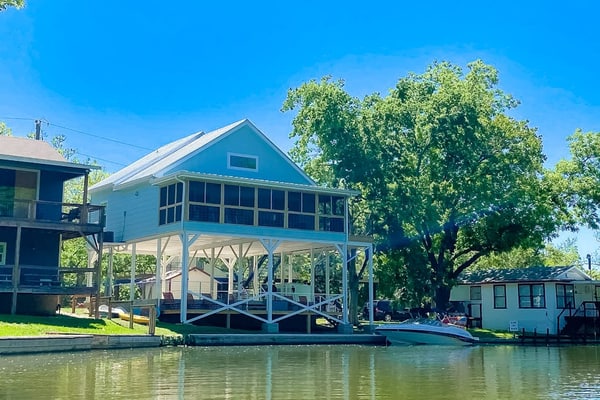 Lakefront dog-friendly home with kayaks, SUP's, huge screened porch