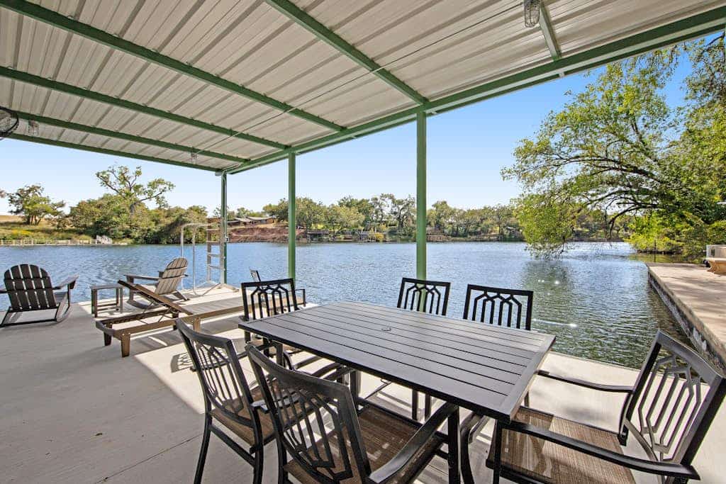 Two-story waterfront retreat with boat dock, two firepits & two kayaks