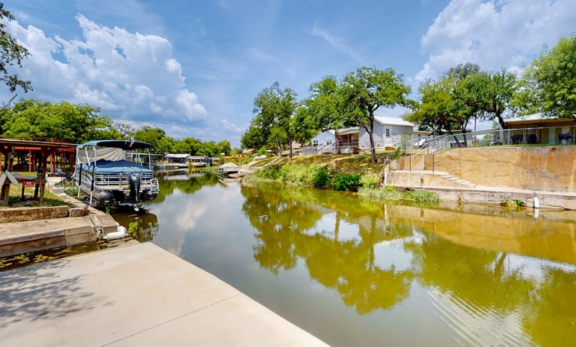 Dog-friendly waterfront home with dock, grill, water views, patio, washer/dryer
