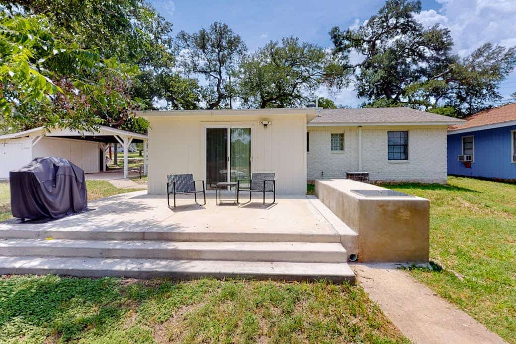 Dog-friendly waterfront home with dock, grill, water views, patio, washer/dryer
