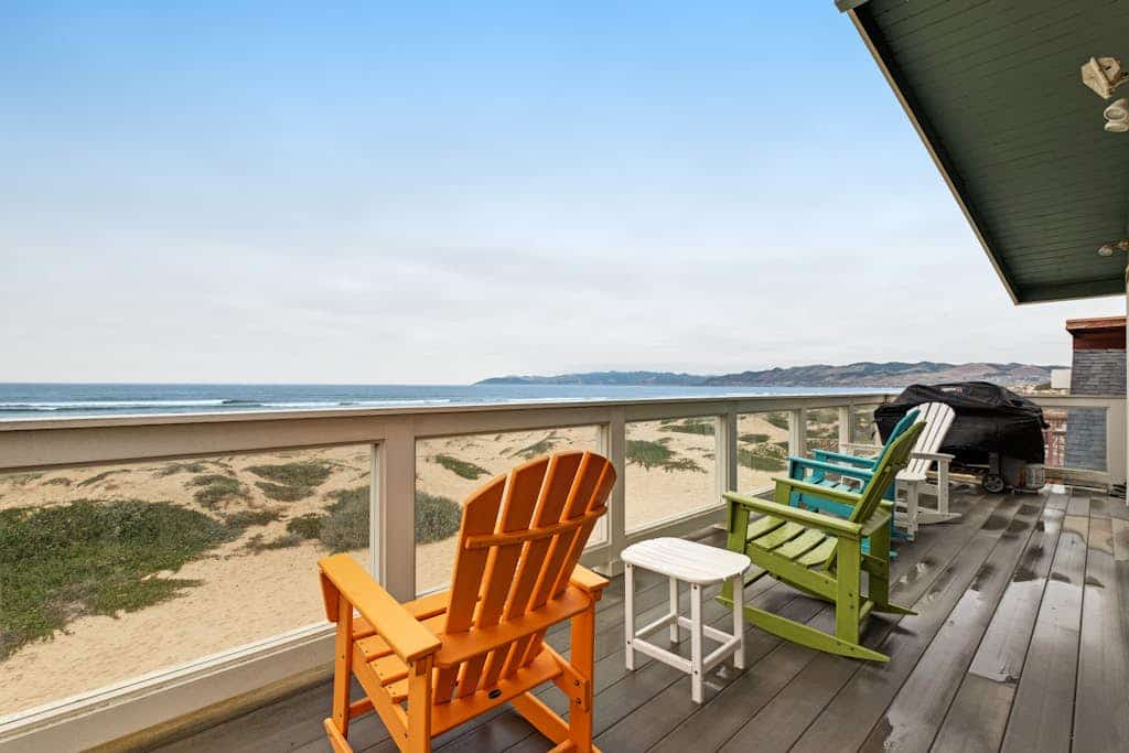 Beachfront home with amazing ocean views, a two-level deck, and bikes