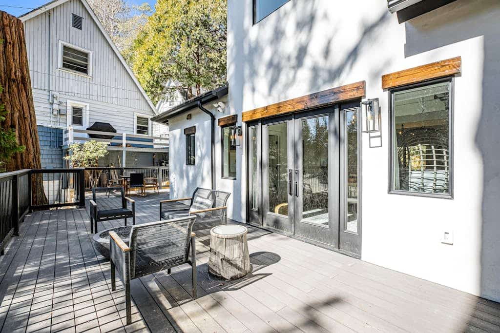 Stunning lakehouse lodge with a deck, fireplace, lush patio & lake access