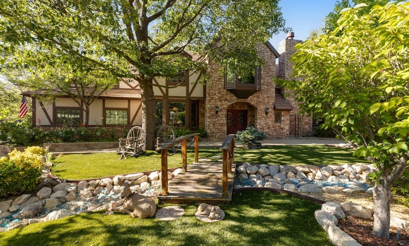 Expansive estate with hot tub, putting green, gourmet kitchen, & fireplaces
