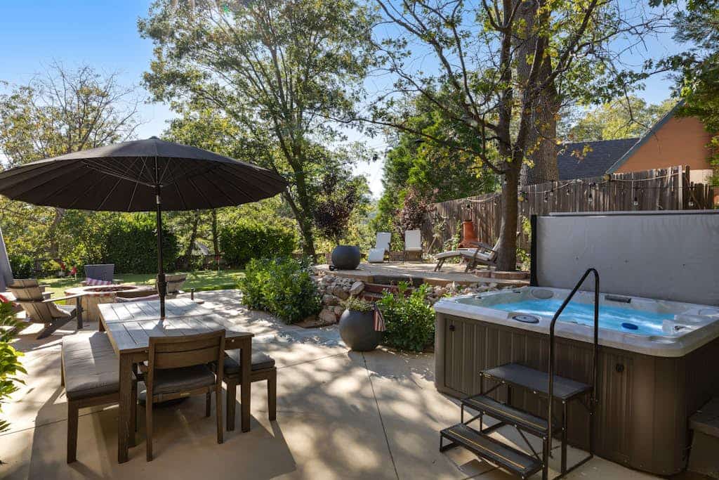 Expansive estate with hot tub, putting green, gourmet kitchen, & fireplaces