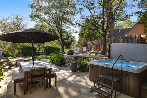 Expansive estate with hot tub, putting green, gourmet kitchen, & fireplaces