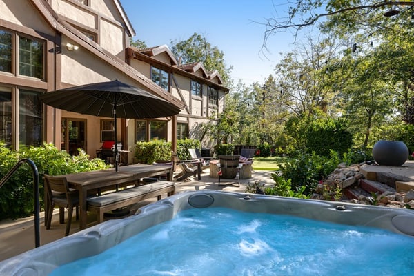Expansive estate with hot tub, putting green, gourmet kitchen, & fireplaces