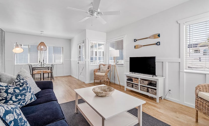 Updated 2nd-floor retreat with deck, AC, 2 car parking- steps from beach