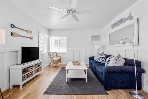 Updated 2nd-floor retreat with deck, AC, 2 car parking- steps from beach