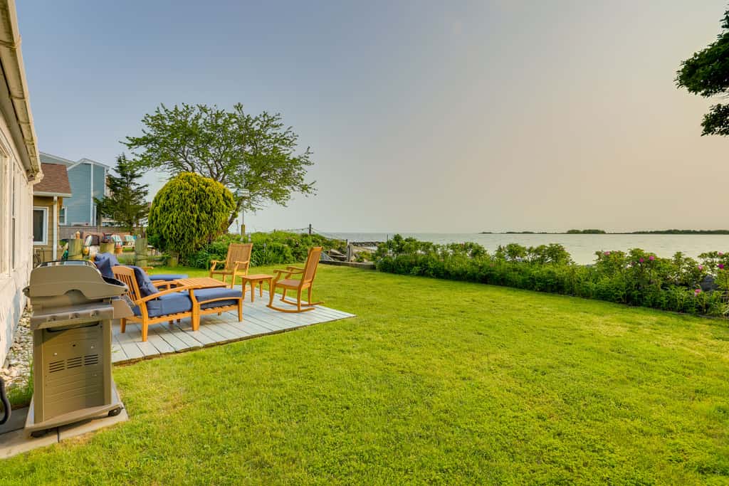 Waterfront Cottage w/ Sunroom + Patio & Grill