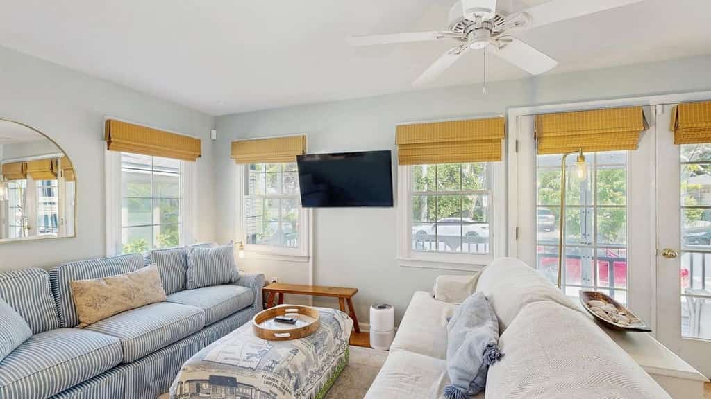 Rehoboth Beach House | COMBO UNIT 3-Bedroom, 2-Bath & 2-Bedroom 1 Bath: Whole-Building Rental with Screened Porch

Looking to rent an entire building steps from the beach in Rehoboth Beach, Delaware? This unique whole-building vacation rental combines two private condos — a 3-bedroom unit and a 2-bedroom unit — for a total of 5 bedrooms and 3 full bathrooms, making it the ideal choice for large families, multi-family groups, or reunions seeking space, privacy, and flexibility.

Both units are fully equipped with all the comforts of home and share the same unbeatable location: within walking distance to Rehoboth Beach, the boardwalk, and downtown attractions, yet tucked away from the crowds. Each unit features a spacious porch — perfect for morning coffee, evening cocktails, or simply soaking in the coastal air. Two convenient outdoor showers handle sandy toes and beach gear with ease, and Cranberry Park sits just across the street for extra family-friendly fun.

Inside each unit, guests can unwind in the living room with a smart TV for streaming shows and movies. Both fully equipped kitchens include all major appliances and a dishwasher for stress-free cleanup after home-cooked meals. The lower-level unit also has its own private washer and dryer available
Highlights:
• 5 bedrooms total (3-bedroom + 2-bedroom units)
• 3 full bathrooms
• Entire building — ideal for large groups and multi-family stays
• Steps from Rehoboth Beach, the boardwalk, and downtown
• Two porches and two outdoor showers
• Two fully equipped kitchens + dishwashers
• Three smart TVs and free WiFi throughout
• Central A/C and private washer/dryer in each unit
• Near Cranberry Park — great for families

Delaware Accommodations Intermediary License #2024712698

<b>Things to Know</b>
There are two private parking spaces behind the house, ideal for compact cars and small SUVs. Please enter and exit the driveway slowly.  For larger vehicles, or if you have additional cars, the owner provides two City of Rehoboth Beach parking permits for use on non-metered streets.
Check-in time: 4:00 p.m.
Check-out time: 10:00 a.m.
All guests shall abide by our good neighbor policy and shall not engage in illegal activity. Quiet hours are from 10:00 p.m. to 8:00 a.m.
No smoking is permitted anywhere on the premises.
Delaware regulations require all guests sign a lease agreement within 10 days of booking. A lease agreement will be sent within 24 hours of booking and an electronic signature is required before final check-in information is made available.