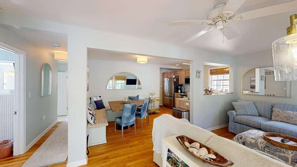 Rehoboth Beach House | COMBO UNIT 3-Bedroom, 2-Bath & 2-Bedroom 1 Bath: Whole-Building Rental with Screened Porch

Looking to rent an entire building steps from the beach in Rehoboth Beach, Delaware? This unique whole-building vacation rental combines two private condos — a 3-bedroom unit and a 2-bedroom unit — for a total of 5 bedrooms and 3 full bathrooms, making it the ideal choice for large families, multi-family groups, or reunions seeking space, privacy, and flexibility.

Both units are fully equipped with all the comforts of home and share the same unbeatable location: within walking distance to Rehoboth Beach, the boardwalk, and downtown attractions, yet tucked away from the crowds. Each unit features a spacious porch — perfect for morning coffee, evening cocktails, or simply soaking in the coastal air. Two convenient outdoor showers handle sandy toes and beach gear with ease, and Cranberry Park sits just across the street for extra family-friendly fun.

Inside each unit, guests can unwind in the living room with a smart TV for streaming shows and movies. Both fully equipped kitchens include all major appliances and a dishwasher for stress-free cleanup after home-cooked meals. The lower-level unit also has its own private washer and dryer available
Highlights:
• 5 bedrooms total (3-bedroom + 2-bedroom units)
• 3 full bathrooms
• Entire building — ideal for large groups and multi-family stays
• Steps from Rehoboth Beach, the boardwalk, and downtown
• Two porches and two outdoor showers
• Two fully equipped kitchens + dishwashers
• Three smart TVs and free WiFi throughout
• Central A/C and private washer/dryer in each unit
• Near Cranberry Park — great for families

Delaware Accommodations Intermediary License #2024712698

<b>Things to Know</b>
There are two private parking spaces behind the house, ideal for compact cars and small SUVs. Please enter and exit the driveway slowly.  For larger vehicles, or if you have additional cars, the owner provides two City of Rehoboth Beach parking permits for use on non-metered streets.
Check-in time: 4:00 p.m.
Check-out time: 10:00 a.m.
All guests shall abide by our good neighbor policy and shall not engage in illegal activity. Quiet hours are from 10:00 p.m. to 8:00 a.m.
No smoking is permitted anywhere on the premises.
Delaware regulations require all guests sign a lease agreement within 10 days of booking. A lease agreement will be sent within 24 hours of booking and an electronic signature is required before final check-in information is made available.