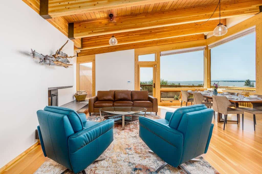 Featured in Alaska's Best Kitchens Magazine—and earning every bit of the title. A solid redwood island, a pro Miele cooktop, a steam oven, a convection oven, and dual dishwashers anchor the kitchen of this premium upper-level Anchorage triplex, turning meal prep into a highlight of the trip rather than a chore. The expansive views continue through the living spaces, framing the waters of Cook Inlet and Sleeping Lady. Step outside into a shared park-like garden retreat to fire up the deluxe gas grill, dine alfresco, or soak in your private hot tub. Includes independent home office nooks in each bedroom for seamless remote work and a tranquil downstairs sunroom. Standard Specs: Award-winning chef's kitchen, private outdoor hot tub, shared landscaped gardens with gas grill, dual remote work office nooks, flat-screen TV, high-speed WiFi, and keypad entry. Designated driveway parking for one vehicle. Fireplace is decorative only. Sleeps 8.
