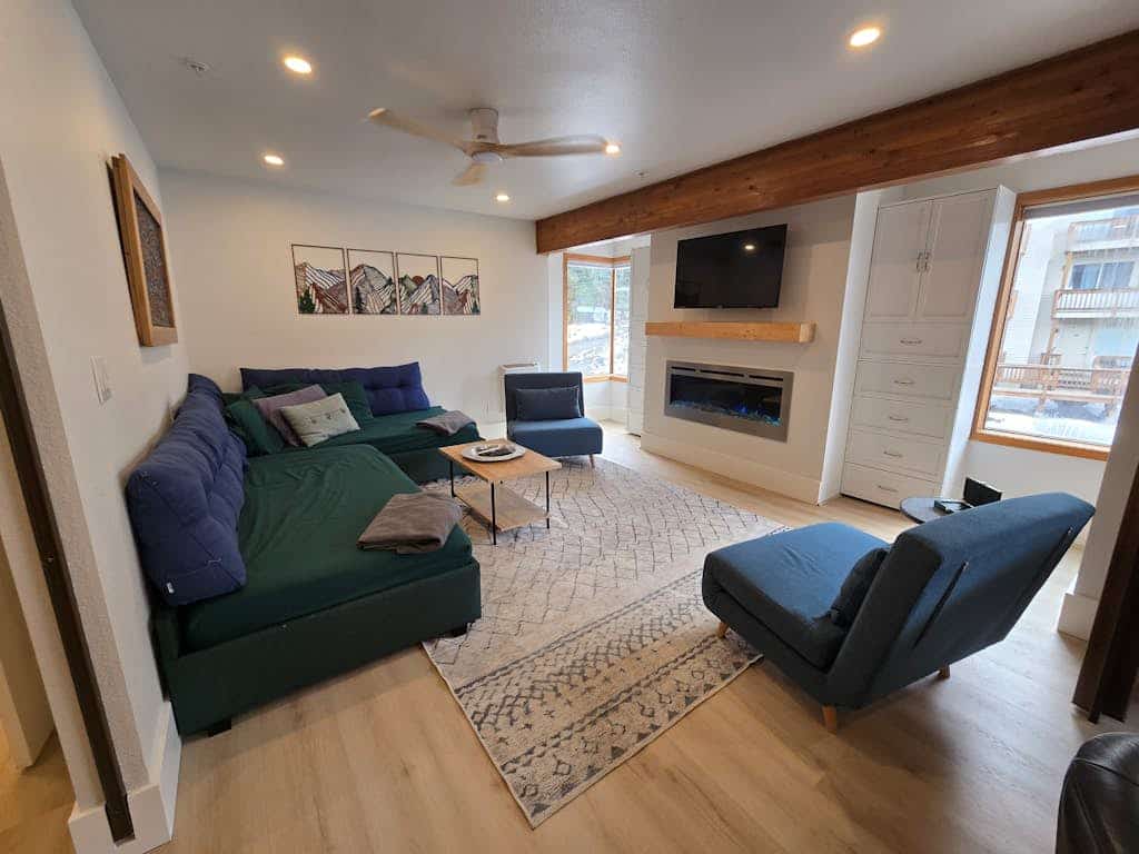 A clever second-floor studio condo engineered for the kind of alpine trip where mornings start directly at the lift and evenings end at the village brewery. Sited ski-in/ski-out at the base of Alyeska Resort, this property puts cafes, pubs, and premier ski trails right at your doorstep. The layout features a well-equipped full kitchen, a four-person breakfast bar for efficient pre-ski fuel, and a functional Murphy bed setup with a dedicated curtain partition to separate the sleeping space from the living lounge. Take your morning coffee out onto the furnished private balcony pointed straight at the Chugach peaks. *No elevator.* Standard Specs: Full kitchen with breakfast bar, private balcony, curtain privacy partition, flat-screen TV, high-speed WiFi, and keypad entry. Dedicated parking for one vehicle. Fireplace non-operational per local regulations. Building requires stair access. Sleeps 4.