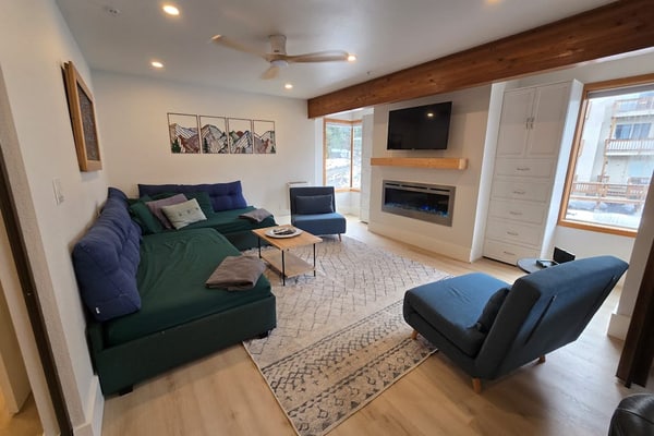 A clever second-floor studio condo engineered for the kind of alpine trip where mornings start directly at the lift and evenings end at the village brewery. Sited ski-in/ski-out at the base of Alyeska Resort, this property puts cafes, pubs, and premier ski trails right at your doorstep. The layout features a well-equipped full kitchen, a four-person breakfast bar for efficient pre-ski fuel, and a functional Murphy bed setup with a dedicated curtain partition to separate the sleeping space from the living lounge. Take your morning coffee out onto the furnished private balcony pointed straight at the Chugach peaks. *No elevator.* Standard Specs: Full kitchen with breakfast bar, private balcony, curtain privacy partition, flat-screen TV, high-speed WiFi, and keypad entry. Dedicated parking for one vehicle. Fireplace non-operational per local regulations. Building requires stair access. Sleeps 4.