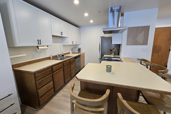 A clever second-floor studio condo engineered for the kind of alpine trip where mornings start directly at the lift and evenings end at the village brewery. Sited ski-in/ski-out at the base of Alyeska Resort, this property puts cafes, pubs, and premier ski trails right at your doorstep. The layout features a well-equipped full kitchen, a four-person breakfast bar for efficient pre-ski fuel, and a functional Murphy bed setup with a dedicated curtain partition to separate the sleeping space from the living lounge. Take your morning coffee out onto the furnished private balcony pointed straight at the Chugach peaks. *No elevator.* Standard Specs: Full kitchen with breakfast bar, private balcony, curtain privacy partition, flat-screen TV, high-speed WiFi, and keypad entry. Dedicated parking for one vehicle. Fireplace non-operational per local regulations. Building requires stair access. Sleeps 4.