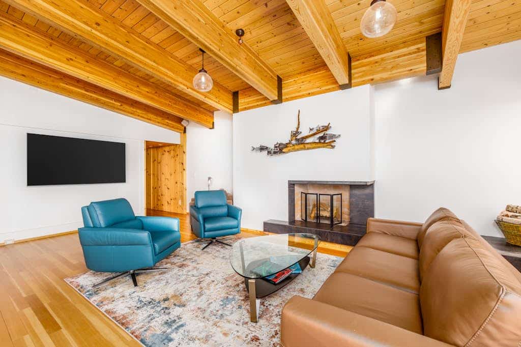The complete, park-like M Street estate—combining three independent, high-end mid-century modern vacation rentals into a single downtown Anchorage triplex compound. Offering three independent private hot tubs, a lushly landscaped shared garden paradise, pro gas grills, and alfresco dining decks, this property is an unmatched asset built specifically for weddings, corporate retreats, reunions, and large-scale group getaways. The expansive Cook Inlet and mountain views continue inside, where the top-floor primary residence features an award-winning gourmet kitchen featured in Alaska's Best Kitchens Magazine—packed with a solid redwood island, a Miele cooktop, a steam oven, convection oven, and dual dishwashers. Walking distance to the Coastal Trail, Performing Arts Center, and downtown dining. Standard Specs: Three fully equipped kitchen/kitchenette spaces, grand-prize chef's kitchen, three private hot tubs, shared gardens with gas grills, fireplaces, flat-screen TVs, high-speed WiFi, and keypad entry. Off-street driveway parking for three vehicles. Enforces strict zero-tolerance guest capacity policies. Sleeps 16.