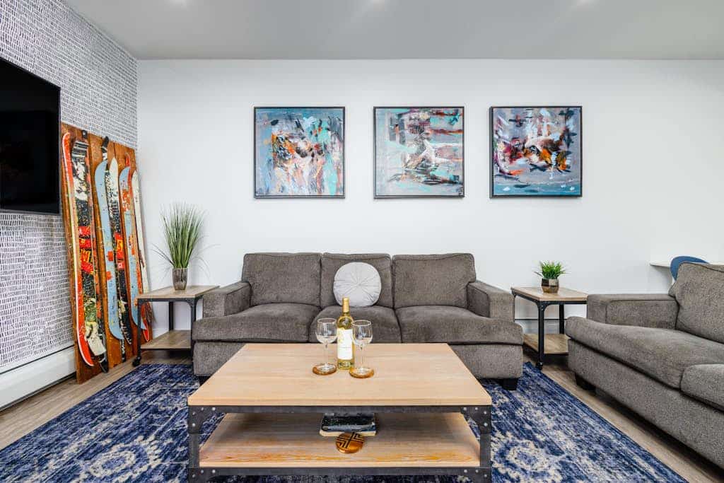 Modern Art lives up to its name—a bold, design-forward townhome in downtown Anchorage featuring creative contemporary art pieces, modern industrial lines, and a private viewing balcony that keeps the Cook Inlet waters constantly in sight. The plush gathering area centers around a sleek modern fireplace, while the gourmet kitchen is a pro host's asset, fully appointed with stainless steel appliances, a beautiful floating kitchen island, and an integrated ice maker. Walk straight out your door to access exceptional neighborhood eateries, artisan shops, and the scenic Tony Knowles Coastal Trail system. Dogs are completely welcome to come along. Standard Specs: Gourmet kitchen with floating island and ice maker, modern fireplace, water-view balcony, private in-unit washer/dryer, flat-screen TV, high-speed WiFi, and keypad entry. Dedicated parking for one vehicle. Dog-friendly. Enforces strict extra-guest policies. Sleeps 4.