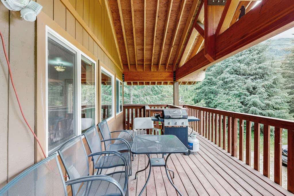 Tucked into the historic mine roads above the valley, Jewel Chalet trades the bustle of the village center for a quieter, more peaceful rhythm. Positioned in an exceptional walking neighborhood near the Turnagain Arm and the Seward Highway, this comfortable home serves as an effortless staging ground for sea kayaking, dog sledding, or winter ski trips. The inviting interior features a clean open layout, a powerful gas fireplace, and two oversized full bathrooms that make cleaning up gear seamless. Step out onto the large covered balcony to grill on the propane barbecue while taking in the fresh mountain air, or use the high-speed WiFi to check local trail conditions. Standard Specs: Fully equipped kitchen, two full bathrooms, gas fireplace, covered deck with propane grill, cable TV, high-speed WiFi, and keypad entry. Driveway parking for two vehicles. Dog-friendly. No A/C. Sleeps 4.