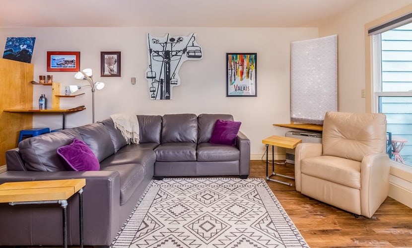 The centerpiece of this premium slopeside condo is an iconic 360-degree fireplace that sits directly in the middle of the open living room, radiating warmth throughout the entire space. Boasting uncompromised full mountain views and true ski-in/ski-out lift access, this one-bedroom-plus-loft condo sits right in the heart of Alaska's ski country. The bright, welcoming interior features a private deck for morning coffee or apres-ski drinks, a well-appointed kitchen, and smart entertainment streams. Positioned directly on the Girdwood shuttle line, the property offers quick walking access to the resort spa facility, trailheads, and valley fine dining. Shared building laundry is located inside the complex. Standard Specs: Full kitchen, 360-degree center fireplace, private viewing deck, flat-screen Smart TV, high-speed WiFi, and keypad entry. Dedicated parking for one vehicle. On-site shared laundry. True ski-in/ski-out. Sleeps 4.