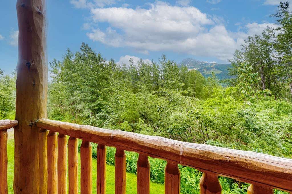 Positioned securely on the second floor of a premier building just a mile from Alyeska Resort, Creekside Retreat delivers clean mountain views out of every single window. Serving as a flawless, highly reliable two-bedroom condo, the home sits within short walking distance of Girdwood’s favorite coffee shops, local restaurants, and the mercantile. Treat your muscles to a deep soak in your private hot tub on the deck while taking in the peaks, or gather inside around the living room's cozy gas fireplace and flat-screen TV. The bright, airy layout is fully functional, offering a well-appointed kitchen with stainless steel appliances and an in-unit washer and dryer. Standard Specs: Fully equipped kitchen with stainless steel appliances, private outdoor hot tub, gas fireplace, private deck, private washer/dryer, flat-screen TV, high-speed WiFi, and keypad entry. Positioned in a secure building with parking for two vehicles. Includes pull-out bedding options. Sleeps 4.