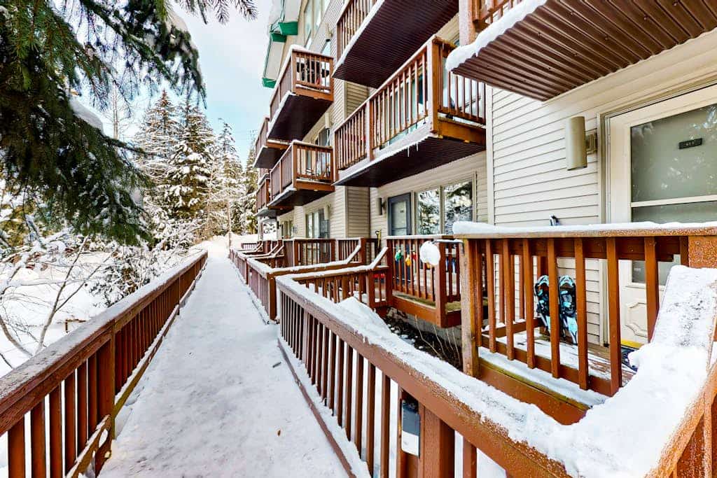 A dog-friendly ski-in/ski-out condo positioned directly at the base of Mt. Alyeska—the rare mountain combination that actually works. Decorated with authentic vintage ski posters, warm wood finishes, and alpine mementos, this cozy condo lets a couple or small family spread out without overcomplicating their vacation logistics. Slide straight off the ski trail and onto your private patio, or cook a real meal in the fully equipped kitchen featuring stainless steel appliances and generous meal-prep space. Glaciers, hiking trails, and local village dining spots are all within a short drive, while the shared on-site laundry keeps all your outdoor gear refreshed. Standard Specs: Fully equipped kitchen with stainless steel appliances, private patio, warm wood interiors, vintage decor, flat-screen Smart TV, keypad entry, and shared building laundry. Dedicated parking for one vehicle. Dog-friendly. No A/C. Sleeps 4.