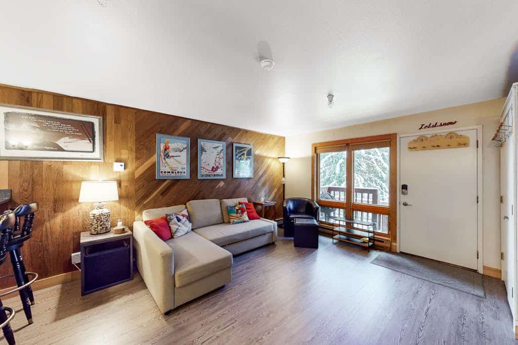 A dog-friendly ski-in/ski-out condo positioned directly at the base of Mt. Alyeska—the rare mountain combination that actually works. Decorated with authentic vintage ski posters, warm wood finishes, and alpine mementos, this cozy condo lets a couple or small family spread out without overcomplicating their vacation logistics. Slide straight off the ski trail and onto your private patio, or cook a real meal in the fully equipped kitchen featuring stainless steel appliances and generous meal-prep space. Glaciers, hiking trails, and local village dining spots are all within a short drive, while the shared on-site laundry keeps all your outdoor gear refreshed. Standard Specs: Fully equipped kitchen with stainless steel appliances, private patio, warm wood interiors, vintage decor, flat-screen Smart TV, keypad entry, and shared building laundry. Dedicated parking for one vehicle. Dog-friendly. No A/C. Sleeps 4.