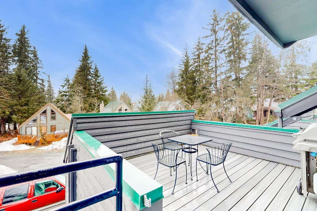 The private outdoor hot tub is brand-new and ultra-luxury—but the real asset is the dramatic, completely unobstructed view of Mount Alyeska it points at. This sun-filled, three-story slopeside townhome sits directly at the base of the lifts, within easy walking distance of the chairlifts and local village restaurants. The ground floor features a high-utility entryway and an oversized mudroom designed specifically for heavy ski or biking gear. The second floor opens into an expansive living, kitchen, and dining area perfect for seamless group hosting, leading directly out to a gas BBQ deck. Includes Apple TV equipped with complimentary Hulu and Netflix accounts. Standard Specs: Fully equipped kitchen, brand-new ultra-luxury outdoor hot tub, gas BBQ deck, mudroom gear staging area, Apple TV (with complimentary corporate Netflix/Hulu), flat-screen TV, high-speed WiFi, and keypad entry. Dedicated parking for three vehicles. Three-story layout. Sleeps 8.