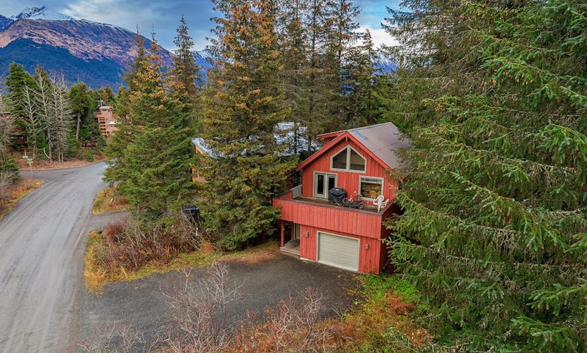 Hidden away in a quiet, peaceful neighborhood just a short half-mile walk to the lifts at Alyeska Resort—close enough to walk in ski gear, far enough that the neighborhood stays quiet. This charming four-bedroom home features an exceptional western exposure that fills the open living spaces with natural afternoon light across all seasons. The spacious floor plan features a roomy viewing deck with a gas grill for summer cookouts, a well-equipped full kitchen built to handle family meal times with ease, and complimentary high-speed WiFi. Settle in for a quiet weekend or use the home as a reliable staging point for day trips to Portage Valley, Crow Creek Mine, or the Kenai Peninsula. Standard Specs: Fully equipped kitchen, private viewing deck, gas grill, private in-unit washer/dryer, flat-screen TV, complimentary high-speed WiFi, and hospitality check-in instructions. Driveway parking for up to four vehicles. Quiet residential neighborhood. Sleeps 8.