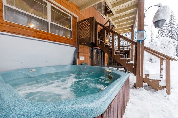 The trick to a successful group trip is having a house engineered to handle the headcount—and Chateau Cervin handles it seamlessly. Tucked into a quiet cul-de-sac just moments from the Alyeska resort chairlifts, this high-capacity chalet looks out over uncompromised views of Max's Mountain. The expansive floor plan splits the crowd intelligently across multiple levels, featuring two full kitchens on separate floors, two independent living areas with fireplaces, and a massive lower-level gear-staging and game room equipped with a pool table and foosball. After a day on the snow, gather on the covered porch for a long soak in the oversized private hot tub. Standard Specs: High-capacity layout with two full kitchens, two fireplaces, private washer/dryer, flat-screen TVs, high-speed WiFi, and keypad entry. Massive private driveway with parking space for six vehicles. Sleeps 15.