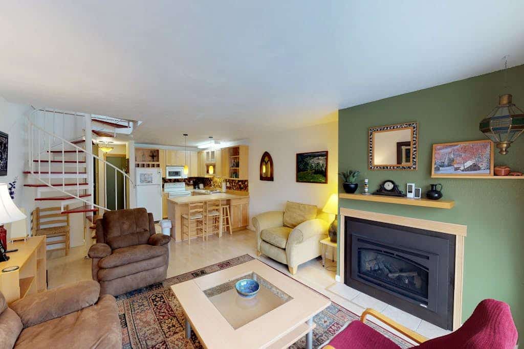 Renovated completely where it counts while keeping its original mountain character intact, this two-story townhouse condo sits a short walk from the Alyeska chairlifts in central Girdwood. The layout features an open kitchen-living area anchored by a powerful gas fireplace, a private balcony for taking in the cool valley air, and a custom spiral staircase climbing to the upper loft bedrooms. Walk to skiing, catch a Nordic trail at Moose Meadow Park just a couple blocks north, or stroll over to the local mercantile and galleries. Standard Specs: Fully equipped kitchen, gas fireplace, private balcony, flat-screen TVs, high-speed WiFi, and keypad entry. Dedicated parking for two vehicles. Two-story layout. Sleeps 6.
