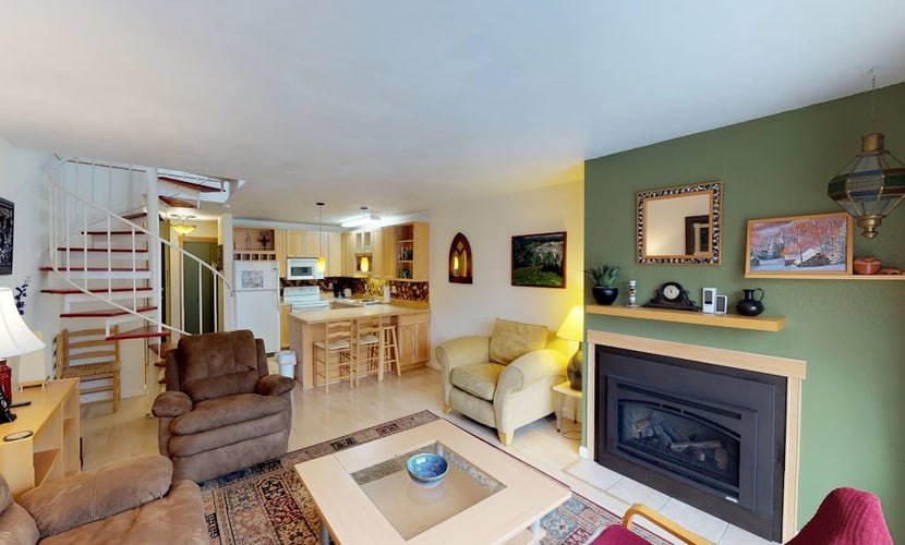 Renovated completely where it counts while keeping its original mountain character intact, this two-story townhouse condo sits a short walk from the Alyeska chairlifts in central Girdwood. The layout features an open kitchen-living area anchored by a powerful gas fireplace, a private balcony for taking in the cool valley air, and a custom spiral staircase climbing to the upper loft bedrooms. Walk to skiing, catch a Nordic trail at Moose Meadow Park just a couple blocks north, or stroll over to the local mercantile and galleries. Standard Specs: Fully equipped kitchen, gas fireplace, private balcony, flat-screen TVs, high-speed WiFi, and keypad entry. Dedicated parking for two vehicles. Two-story layout. Sleeps 6.