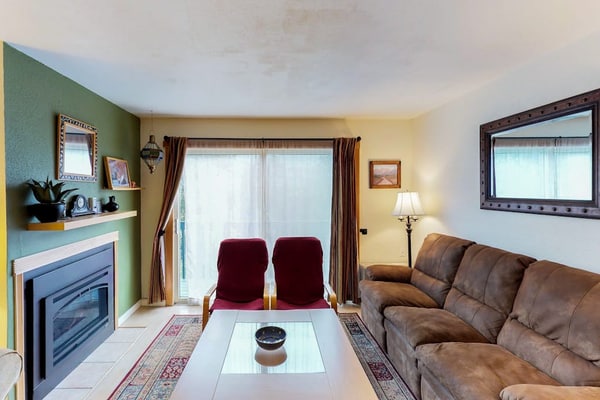 Renovated completely where it counts while keeping its original mountain character intact, this two-story townhouse condo sits a short walk from the Alyeska chairlifts in central Girdwood. The layout features an open kitchen-living area anchored by a powerful gas fireplace, a private balcony for taking in the cool valley air, and a custom spiral staircase climbing to the upper loft bedrooms. Walk to skiing, catch a Nordic trail at Moose Meadow Park just a couple blocks north, or stroll over to the local mercantile and galleries. Standard Specs: Fully equipped kitchen, gas fireplace, private balcony, flat-screen TVs, high-speed WiFi, and keypad entry. Dedicated parking for two vehicles. Two-story layout. Sleeps 6.