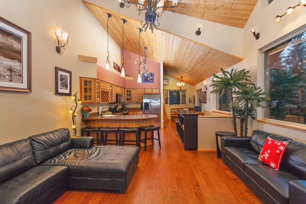 Sitting directly across the street from Alyeska Resort, this modern townhouse lets you ski straight to the lifts and walk directly to village dining. The contemporary architecture inside features vaulted ceilings, clean design lines, and a massive floor-to-ceiling stone gas fireplace that draws the mountain landscape right in. The amenities are engineered for premium mountain recovery, featuring a private indoor steam shower, a jetted soaking tub, a fully appointed chef's kitchen, and a large deck pointed at the peaks. *Please note: The outdoor hot tub is temporarily undergoing maintenance until Spring 2025.* Standard Specs: Full kitchen, stone gas fireplace, steam shower, jetted tub, private washer/dryer, flat-screen TV with Netflix, high-speed WiFi, and keypad entry. Parking for one vehicle. True ski-in/ski-out access. Sleeps 6.