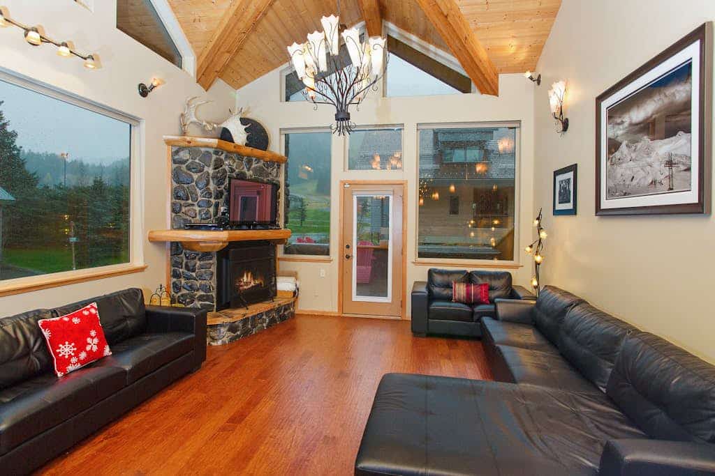Sitting directly across the street from Alyeska Resort, this modern townhouse lets you ski straight to the lifts and walk directly to village dining. The contemporary architecture inside features vaulted ceilings, clean design lines, and a massive floor-to-ceiling stone gas fireplace that draws the mountain landscape right in. The amenities are engineered for premium mountain recovery, featuring a private indoor steam shower, a jetted soaking tub, a fully appointed chef's kitchen, and a large deck pointed at the peaks. *Please note: The outdoor hot tub is temporarily undergoing maintenance until Spring 2025.* Standard Specs: Full kitchen, stone gas fireplace, steam shower, jetted tub, private washer/dryer, flat-screen TV with Netflix, high-speed WiFi, and keypad entry. Parking for one vehicle. True ski-in/ski-out access. Sleeps 6.