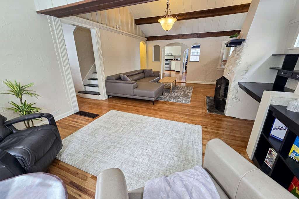 The kind of downtown Anchorage stay where you can completely park the car and walk to dinner. Nestled in a charming, established downtown neighborhood, this classic four-bedroom residence features three full bathrooms and a spacious layout that easily accommodates a group of ten without strain. Unwind after exploring the city around the authentic wood-burning fireplace, cook real meals in the fully equipped pro kitchen, or stream your favorite platforms over high-speed internet. Walking distance to the 5th Avenue Mall, the Anchorage Museum, boutique downtown shopping, and the waterfront bike paths along the Tony Knowles Coastal Trail. Standard Specs: Fully equipped kitchen, traditional wood-burning fireplace, three full bathrooms, private full-size washer/dryer, flat-screen TV, high-speed WiFi, and keypad entry. Neighborhood driveway parking for two vehicles. Cook Inlet waterfront is minutes away. Sleeps 10.