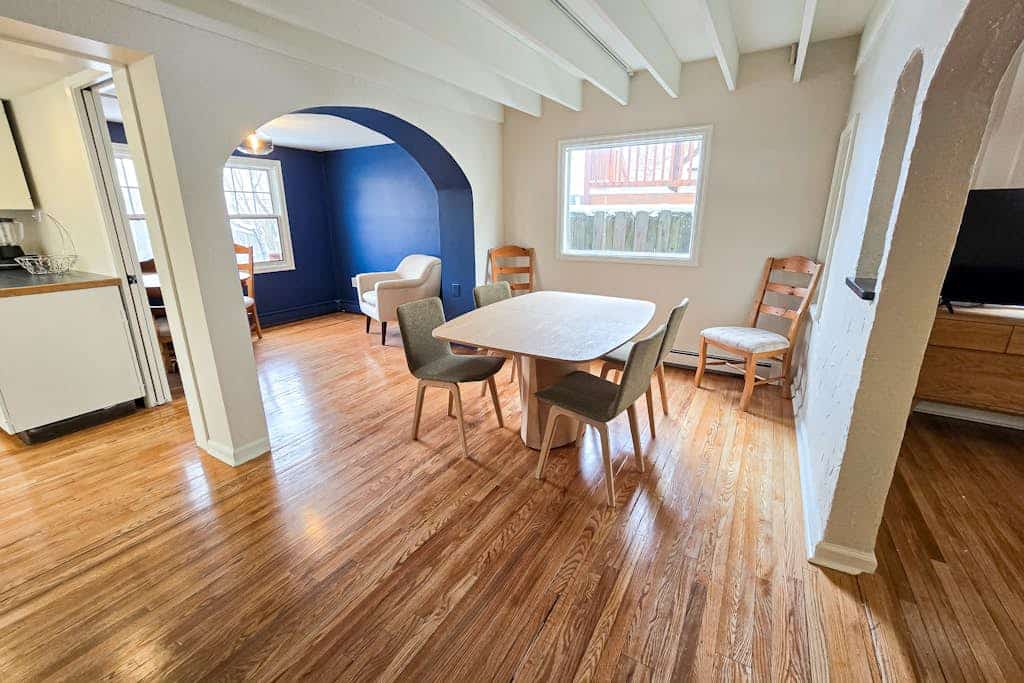 The kind of downtown Anchorage stay where you can completely park the car and walk to dinner. Nestled in a charming, established downtown neighborhood, this classic four-bedroom residence features three full bathrooms and a spacious layout that easily accommodates a group of ten without strain. Unwind after exploring the city around the authentic wood-burning fireplace, cook real meals in the fully equipped pro kitchen, or stream your favorite platforms over high-speed internet. Walking distance to the 5th Avenue Mall, the Anchorage Museum, boutique downtown shopping, and the waterfront bike paths along the Tony Knowles Coastal Trail. Standard Specs: Fully equipped kitchen, traditional wood-burning fireplace, three full bathrooms, private full-size washer/dryer, flat-screen TV, high-speed WiFi, and keypad entry. Neighborhood driveway parking for two vehicles. Cook Inlet waterfront is minutes away. Sleeps 10.