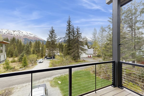 Constructed brand new in 2021 with sharp contemporary finishes and expansive viewing windows that frame the surrounding Chugach peaks, Glacier View Getaway makes a powerful case for the modern Girdwood home. Built specifically for large family groups and outdoor teams who want space without losing a classic mountain feel, the four-bedroom house features an open-concept kitchen built for real cooking and a massive, dedicated lower-level game room equipped with a custom foosball table. Positioned just minutes from Alyeska Resort, Girdwood Brewing Company, and local trailheads. Standard Specs: Gourmet full kitchen, private lower-level game room with foosball, contemporary finishes, large-capacity windows, flat-screen TV, high-speed WiFi, and keypad entry. Driveway parking for two vehicles. Sleeps 11.