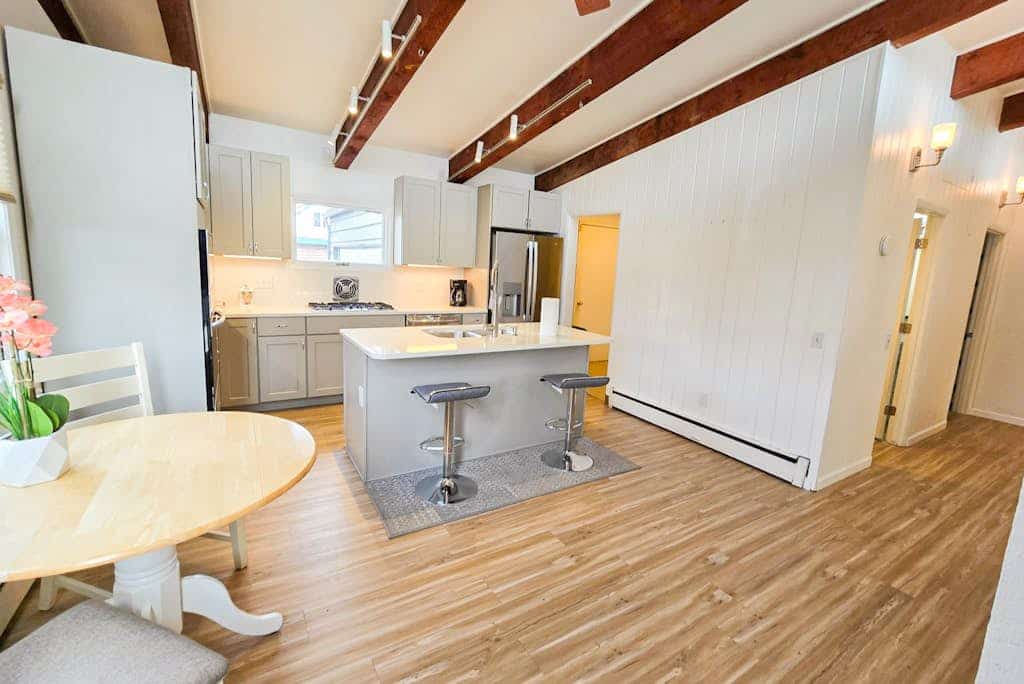 Single-level and easy to settle into, this Anchorage home keeps things uncomplicated — no stairs, a well-lit path to the door, and a layout that works whether you're traveling with family or just want a comfortable base close to town. The living area is made for the end of the day, with a TV and room to spread out, while the full kitchen handles real cooking with a stove, oven, dishwasher, and the rest of what you'd actually reach for. When the weather cooperates, the patio is the spot for a meal outside in the cool Alaskan air. Parks, shopping, and restaurants sit close by, and the bigger draws aren't far — city trails, wildlife viewing, fishing, kayaking, and the museums and gardens around Anchorage. Standard Specs: Full kitchen, queen and twin beds, in-home washer and dryer, high-speed WiFi, and a TV. Patio with outdoor seating. Free parking for two vehicles. Sleeps 3.