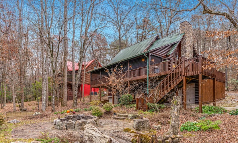 Waterfront retreat with a deck, grill, fireplace, board games, W/D, & central AC