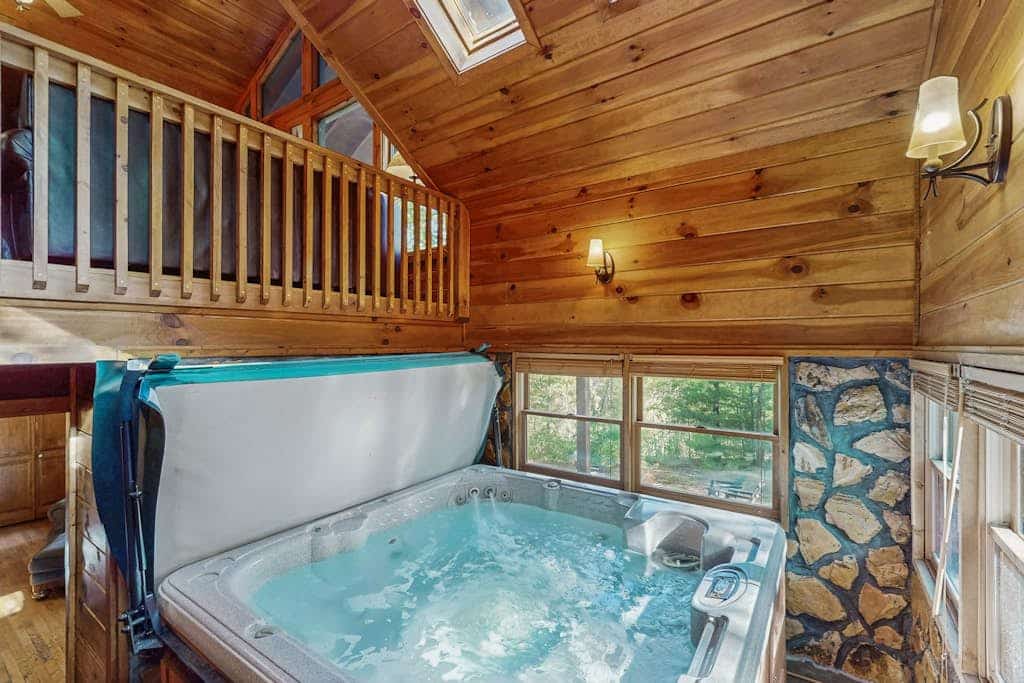 Treetop cabin with private hot tub, furnished deck, & free WiFi - dog-friendly