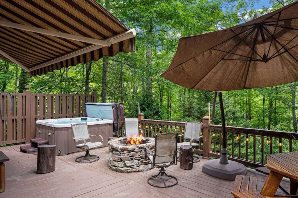 Waterfront cabin with hot tub, firepit, dock, & screened porch - dog-friendly