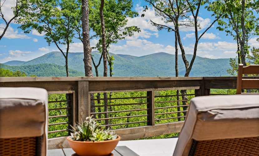 Gated mountaintop retreat with expansive outdoor living, game tables, & hot tub