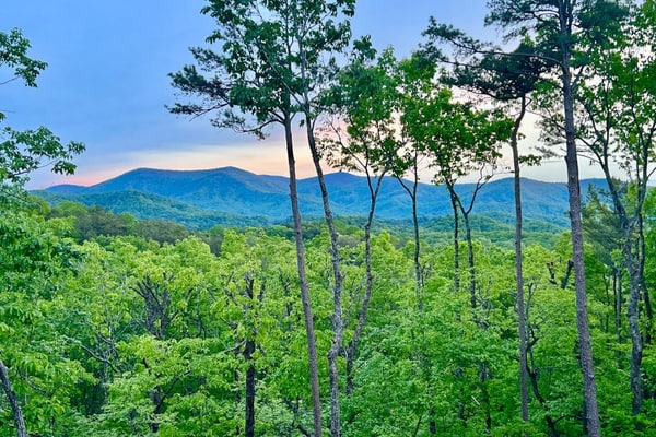 Gated mountaintop retreat with expansive outdoor living, game tables, & hot tub