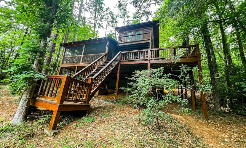 Charming, Waterfront Cabin with a Private Hot Tub, Lakeside Firepit, and Dock