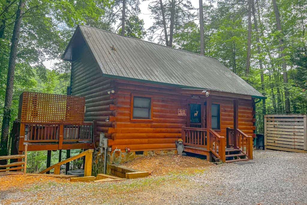 Charming, Waterfront Cabin with a Private Hot Tub, Lakeside Firepit, and Dock