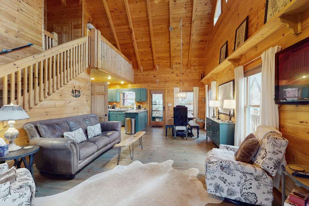 Dog-friendly, cozy cabin with oversized hot tub & gas fireplace on a wooded lot
