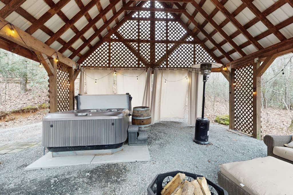 Dog-friendly, cozy cabin with oversized hot tub & gas fireplace on a wooded lot