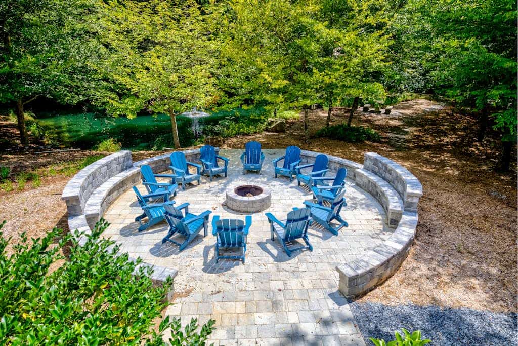 Custom riverfront retreat with private pond, dock, firepit & outdoor living
